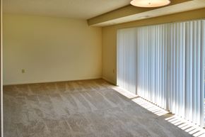 Falls Church apartment for rent - a living room with a large window with long blinds