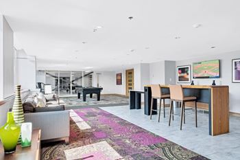 Clubroom with lounge seating, media room and billiards table