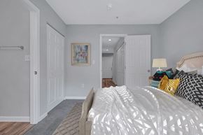 Lexington Park townhouse for rent - a bedroom with a white bed and a closet