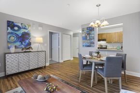 Bladensburg apartment for rent - A dining room with a wooden table and grey chairs.