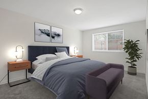 Hyattsville apartment for rent - a bedroom with a bed and a chair
