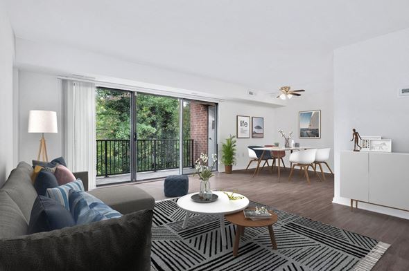 Oxon Hill apartment for rent - a living room with a large window and a balcony