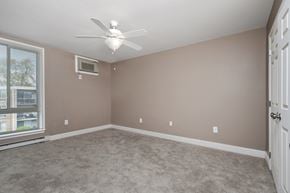 Frederick apartment for rent - an empty bedroom with a ceiling fan and a window