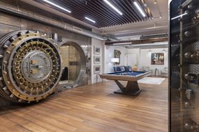 Richmond apartment for rent - a room with a pool table and a rotating wheel on the wall