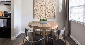 Charlottesville apartment for rent - a dining room with a wooden table and chairs
