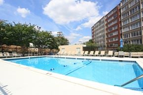 Alexandria apartment for rent - a swimming pool at a hotel in front of a building