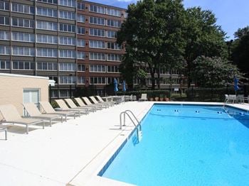 Shimmering swimming pool with spacious sundeck