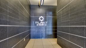 Richmond apartment for rent - the entrance to a plant zero bathroom with a large sign on the side of it