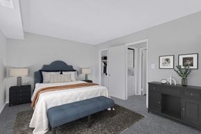 Washington apartment for rent - a bedroom with a bed and a dresser