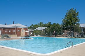 Hyattsville apartment for rent - a swimming pool with a building in the background
