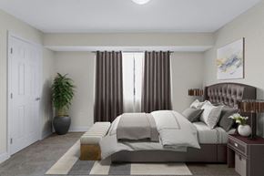 Alexandria apartment for rent - A bedroom with a large bed and a potted plant.
