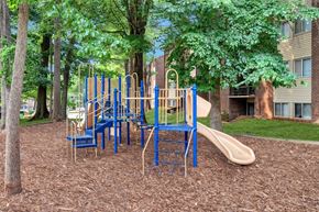 Reston apartment for rent - a playground with slides and chairs