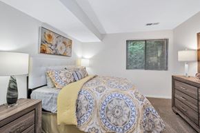 Reston apartment for rent - a bedroom with a bed and two night stands