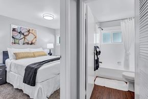 Catonsville apartment for rent - a bedroom with a bed and a bathroom with a shower