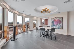 Reston apartment for rent - a dining room with a large table and chairs and a large window