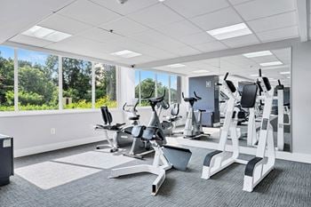 Fitness center with free weights and stretching area
