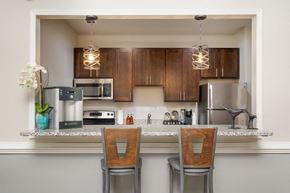 Sterling apartment for rent - a kitchen with a counter top with two chairs