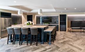 Washington apartment for rent - a large kitchen with a large island and chairs