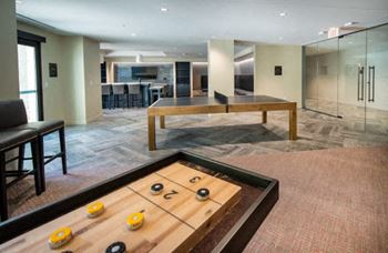 Game room with ping-pong and shuffleboard tables