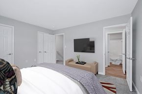 Fredericksburg townhouse for rent - a bedroom with a tv on the wall