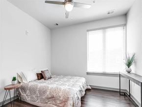 Richmond apartment for rent - a bedroom with a bed and a ceiling fan