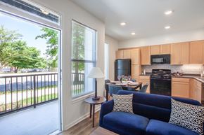 Louisville apartment for rent - Living and kitchen area with access to the outdoor patio--Beecher Terrace, Louisville, KY