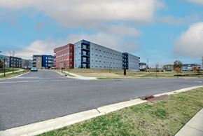 Memphis townhouse for rent - A street view of a residential area with multi-story buildings.
