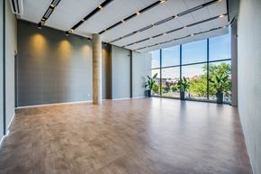 Washington apartment for rent - A large room with wooden floors and a long window.