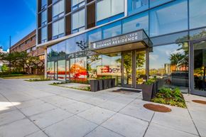 Washington apartment for rent - The entrance to a building with a glass facade and a sign that reads "The John and Jill Ker Conway Residence.".