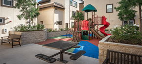 Los Angeles apartment for rent - a playground at Rio Vista Apartments with a picnic table and chairs