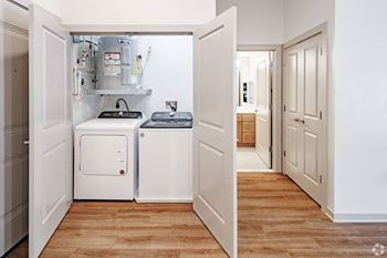 In-home laundry room with full size whirlpool washer & dryer
