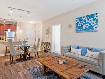 Gambrills apartment for rent - a living room and dining room with a couch and a table