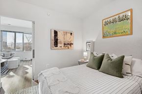 Alexandria apartment for rent - a bedroom with a bed and a bathroom with a window at Sinclaire on Seminary, Alexandria