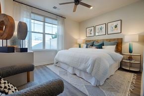 Pennington apartment for rent - a bedroom with a bed and a ceiling fan