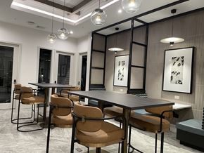 Randolph apartment for rent - A modern dining room with a long table and chairs.
