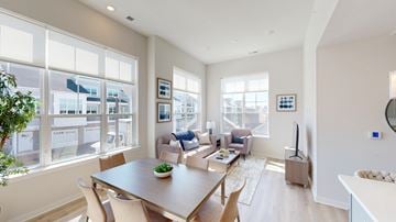 Macungie apartment for rent - A modern living room with a dining table and chairs.