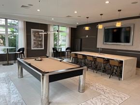 Cranford apartment for rent - Game room with a pool table and resident bar seating and tv