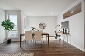 Philadelphia apartment for rent - a dining room with a table and chairs and a television