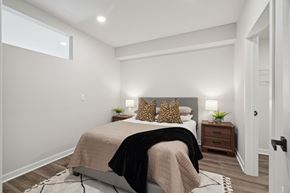 Philadelphia apartment for rent - a bedroom with white walls and a bed with pillows