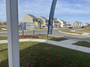 Dover apartment for rent - a street sign in front of a row of houses