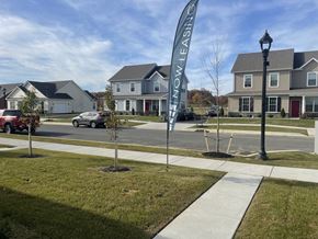 Dover apartment for rent - a sidewalk with a sign in the middle of a street