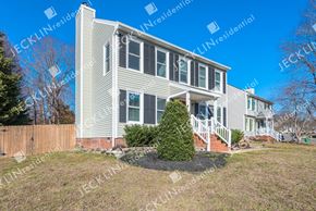 Henrico house for rent - A two-story house with a front yard and a fence.