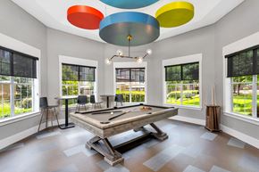 Cedar Park apartment for rent - a game room with a pool table and colorful ceiling lights
