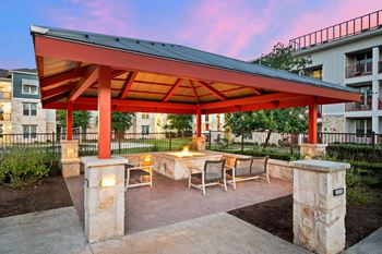 Poolside fire pit with cozy seating