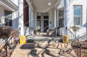 Richmond house for rent - A white house with a front porch and steps leading up to the entrance.