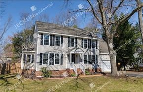 Glen Allen house for rent - A two-story house with a grey roof and white walls.