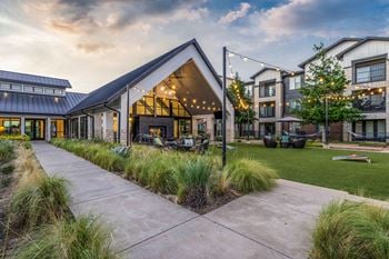 Outdoor entertainment lounge with fireplace, tvs