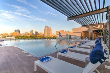 North building: rooftop infinity edge pool with outdoor lounge, cabanas and jumbotron