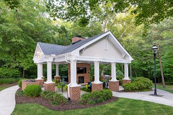 Summerhouse with tv, fireplace, and grills