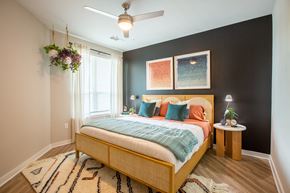 Atlanta apartment for rent - a bedroom with a bed and a ceiling fan